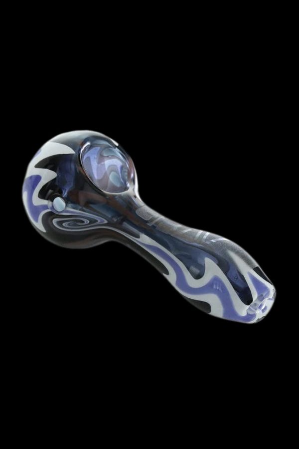 Glass pipe with swirling blue, white, and black patterns against a black background.