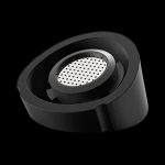 A close-up, angled view of the Pro Vaporizer, showcasing its circular design and dark, matte finish.