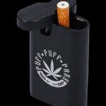 An Aluminum Dugout is shown in a close-up, angled shot, displaying a filled chamber and a cigarette resting on top.