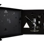 A front view of the Higher Standards Heavy Duty Rig on a black background with a geometric pattern.