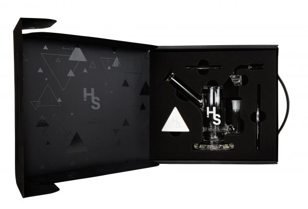 A front view of the Higher Standards Heavy Duty Rig on a black background with a geometric pattern.
