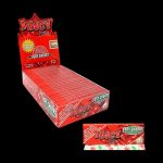 A close-up of Juicy Jay's 1 1/4 Very Cherry Rolling Papers, displaying vibrant branding and a stack of papers in a pink package.