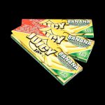 A slightly angled, close-up shot of Juicy Jay's Classic Size Flavored Rolling Papers, displaying a colorful pack with the brand’s logo.