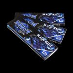 A close-up of the patterned packaging for Juicy Jay's Classic Size Flavored Rolling Papers, viewed from a slight angle.