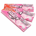 A close-up of Juicy Jay's Classic Size Flavored Rolling Papers package with bold lettering against a vibrant, patterned backdrop.