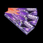 A close-up of Juicy Jay's Classic Size Flavored Rolling Papers package with bold lettering against a vibrant, colorful background.