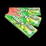 A close-up of stacked Juicy Jay's Classic Size Flavored Rolling Papers, displaying colorful branding and packaging details.