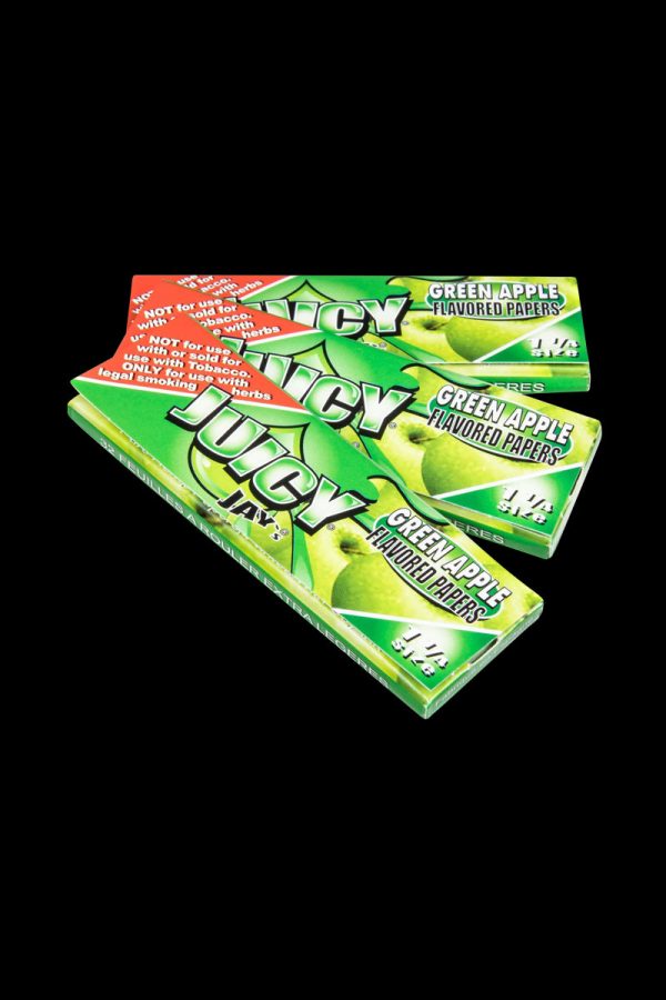 A close-up of stacked Juicy Jay's Classic Size Flavored Rolling Papers, displaying colorful branding and packaging details.