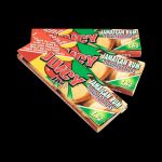 A slightly angled, close-up shot of a pack of Juicy Jay's Classic Size Flavored Rolling Papers with a colorful, patterned design.