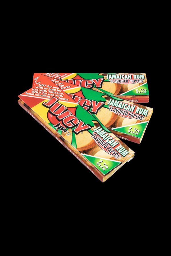 A slightly angled, close-up shot of a pack of Juicy Jay's Classic Size Flavored Rolling Papers with a colorful, patterned design.
