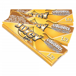 A close-up, angled shot of Juicy Jay's Classic Size Flavored Rolling Papers, displaying vibrant branding and colorful designs.