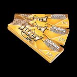 A stack of Juicy Jay's Classic Size Flavored Rolling Papers displayed at a slight angle, showing the patterned design on the booklet.