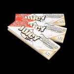 A close-up of Juicy Jay's Classic Size Flavored Rolling Papers package with a colorful design and bold lettering against a white background.