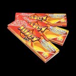 A close-up of Juicy Jay's Classic Size Flavored Rolling Papers package, showing a colorful design and branding details.