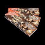 Front view of a package of Juicy Jay's Classic Size Flavored Rolling Papers, featuring a colorful design with text and branding elements.