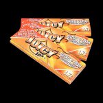 A close-up, angled view of Juicy Jay's Classic Size Flavored Rolling Papers package with colorful branding details.