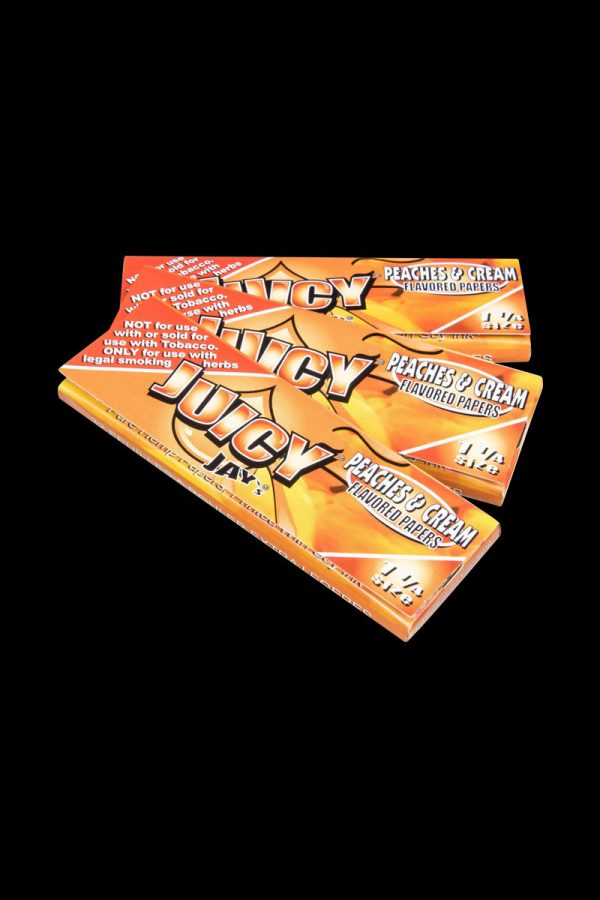 A close-up, angled view of Juicy Jay's Classic Size Flavored Rolling Papers package with colorful branding details.