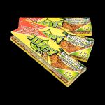 A close-up of Juicy Jay's Classic Size Flavored Rolling Papers, showing the colorful packaging with a distinct floral design.