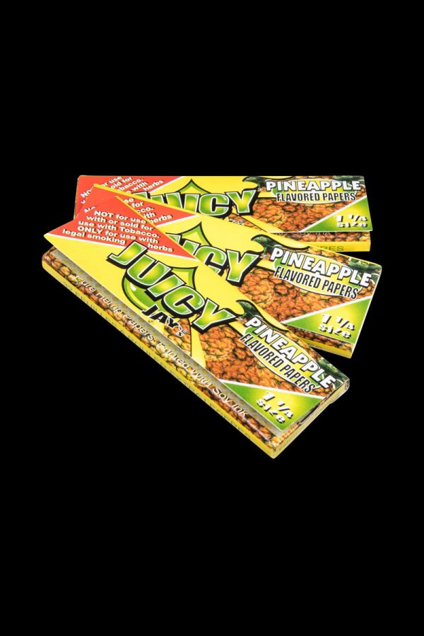 A close-up of Juicy Jay's Classic Size Flavored Rolling Papers, showing the colorful packaging with a distinct floral design.