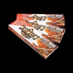 A brightly lit, angled view of a pack of Juicy Jay's Classic Size Flavored Rolling Papers, displaying colorful branding and text.