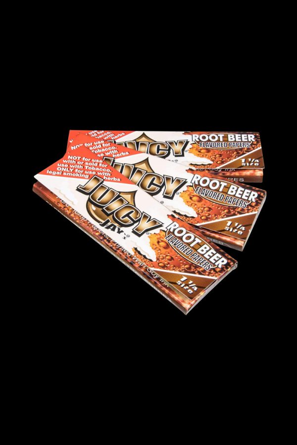 A brightly lit, angled view of a pack of Juicy Jay's Classic Size Flavored Rolling Papers, displaying colorful branding and text.