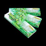 A stack of Juicy Jay's Classic Size Flavored Rolling Papers is shown in a close-up, angled shot with colorful designs.