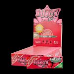 Close-up of Juicy Jay's 1 1/4 Raspberry Rolling Papers package, showcasing the vibrant branding and colorful design.