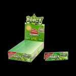 A close-up of the packaging for Juicy Jay's Green Apple Rolling Papers, displaying a bright, colorful design with the brand logo.