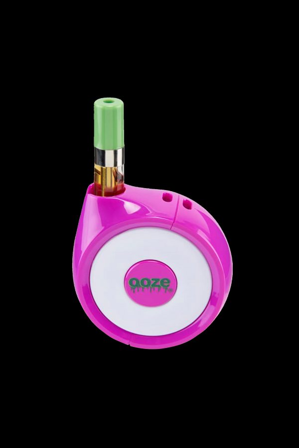 Pink and white cannabis vape pen with a green mouthpiece, displaying the “ooze” logo.