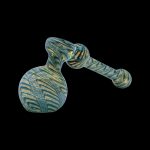 Green and gold glass bubbler pipe against a black background.