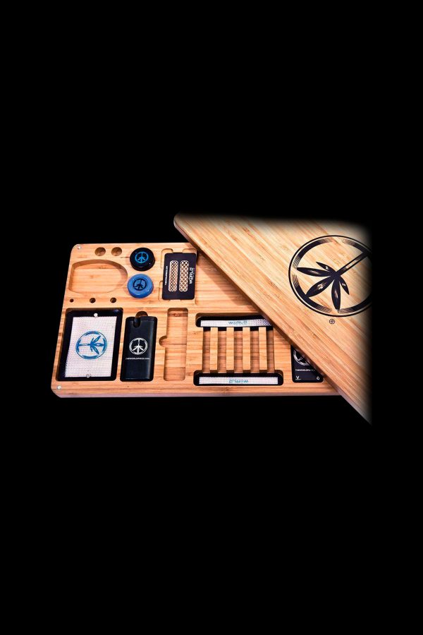 Wooden cannabis rolling tray with peace sign accents and compartments for accessories, displayed against a black background.
