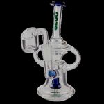 Clear glass dab rig with intricate percolator and quartz banger.