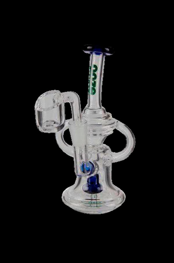 Clear glass dab rig with intricate percolator and quartz banger.