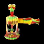 A front view of the Clobb 4 in 1 Silicone Pipe, showing a colorful, textured design against a dark background.