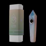 A box for “Astral Project” cannabis accessories alongside a colorful, crystal-shaped smoking pipe.