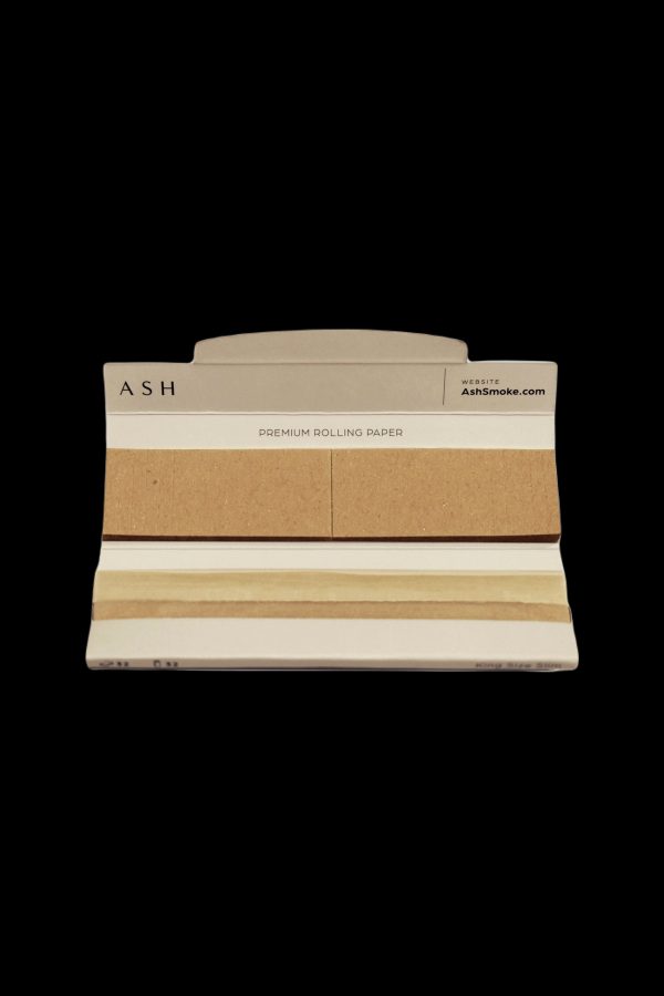 Pack of beige rolling papers with “ASH” branding and website address on a white background.