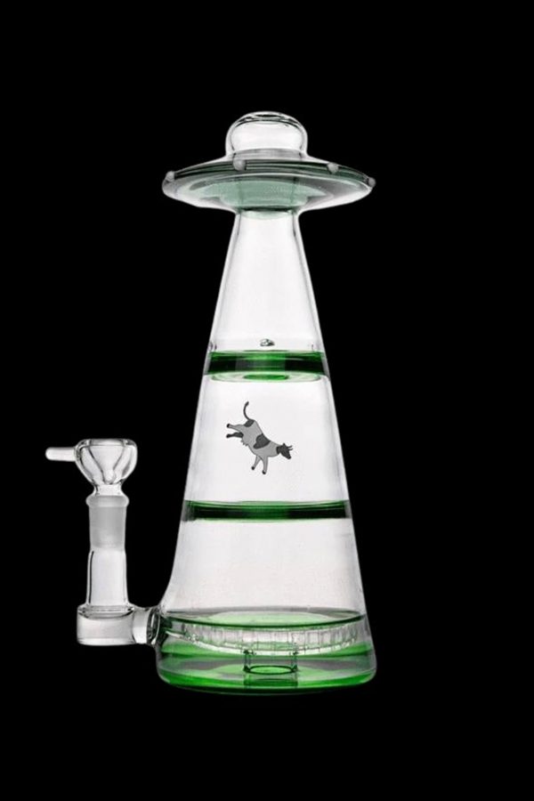 A glass water pipe shaped like a UFO with a cowboy graphic inside, accompanied by a glass bowl.