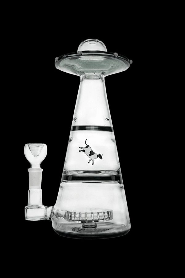 Glass water pipe shaped like a UFO with a cow graphic.