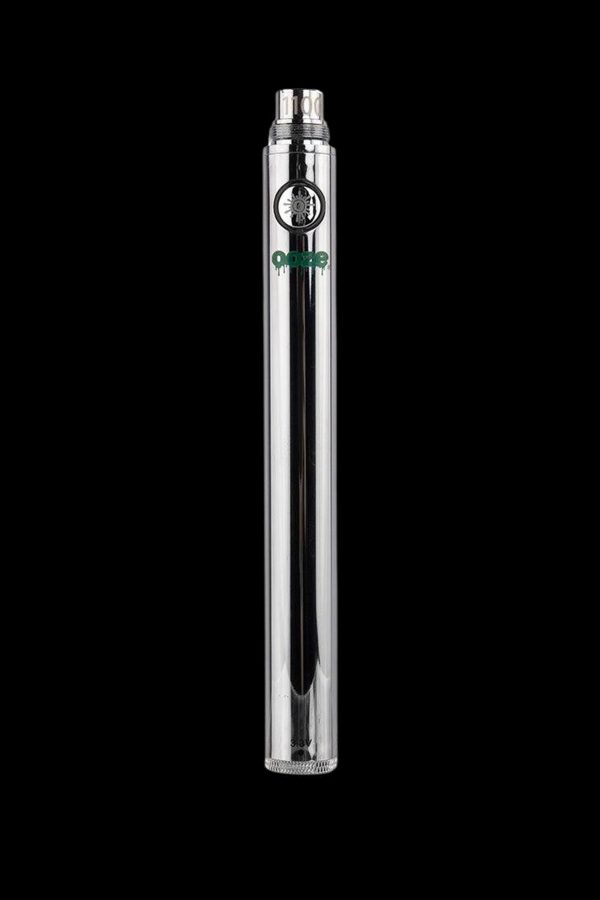 Silver cannabis oil vape pen with clear glass cartridge, displaying a green “Dope” logo.
