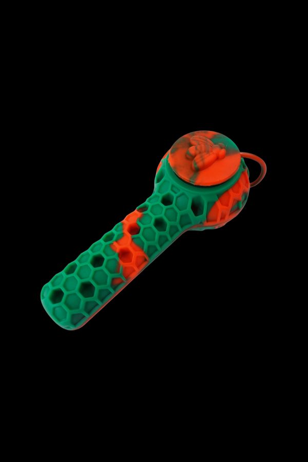 Green and orange silicone pipe with honeycomb texture.