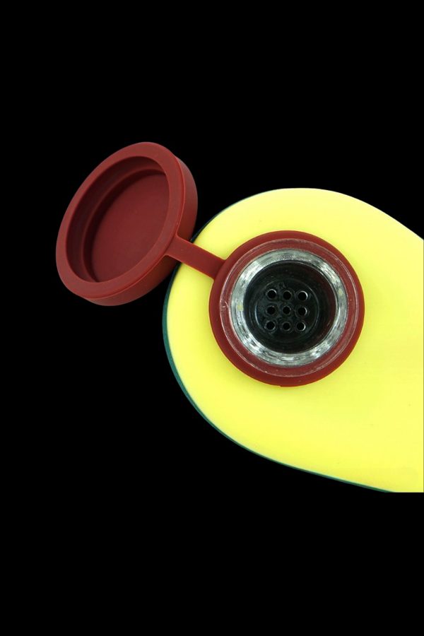 Yellow silicone cannabis container with red lid, displaying a perforated insert.