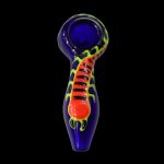 A vibrant glass pipe with a scorpion design, set against a black background.