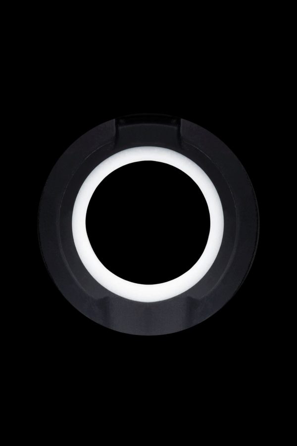 Black cannabis oil vape cartridge with a glowing white ring.