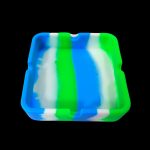 Blue and green silicone hash tray isolated on a black background.