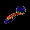 Colorful glass smoking pipe against a black background.