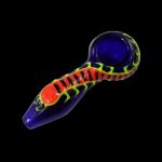 Colorful glass smoking pipe against a black background.