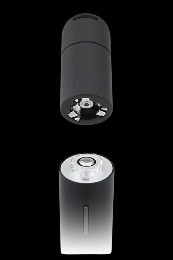 Black cannabis vaporizer pen shown with both ends exposed, one displaying the atomizer and the other the charging port.