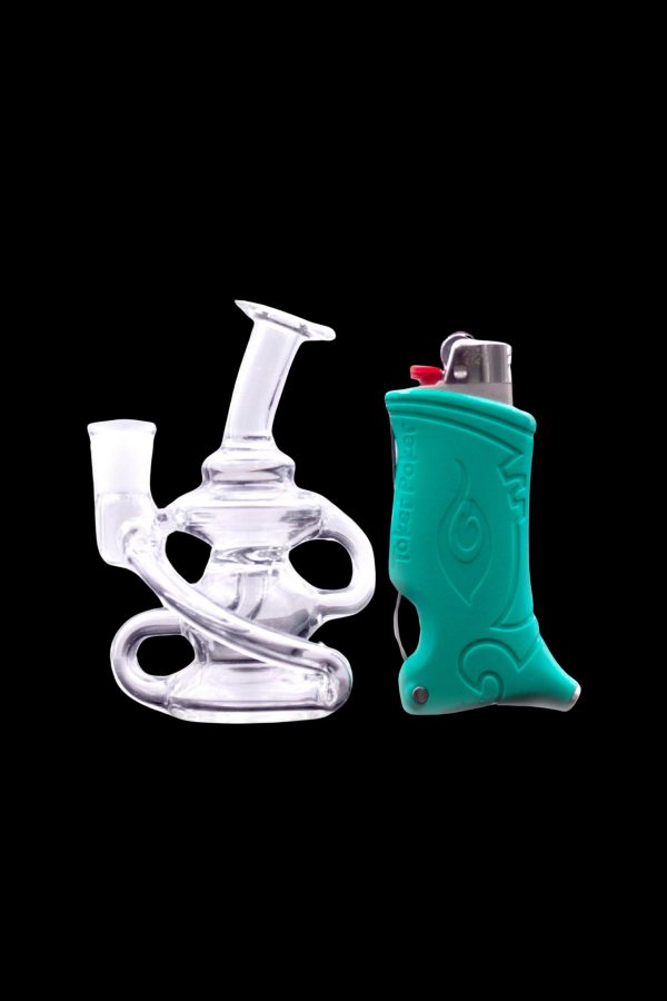 Clear glass rig and turquoise silicone lighter sleeve against a black background.