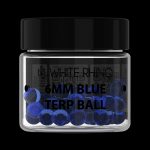 A glass jar filled with blue cannabis terp balls labeled “White Rhino 6mm Blue Terp Ball” against a black background.