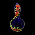 Purple glass pipe with red and yellow flame-like swirls against a black background.